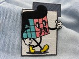 Würfel Patch auf hellblauer Jeans
