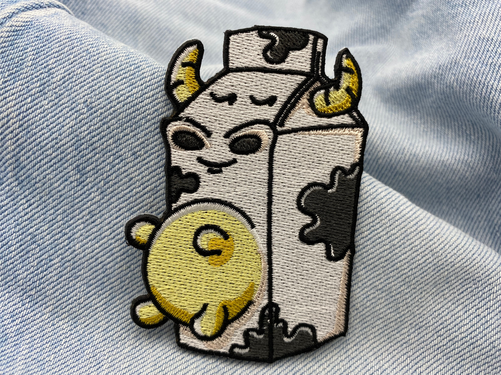 Milch Kuh Patch auf hellblauer Jeans