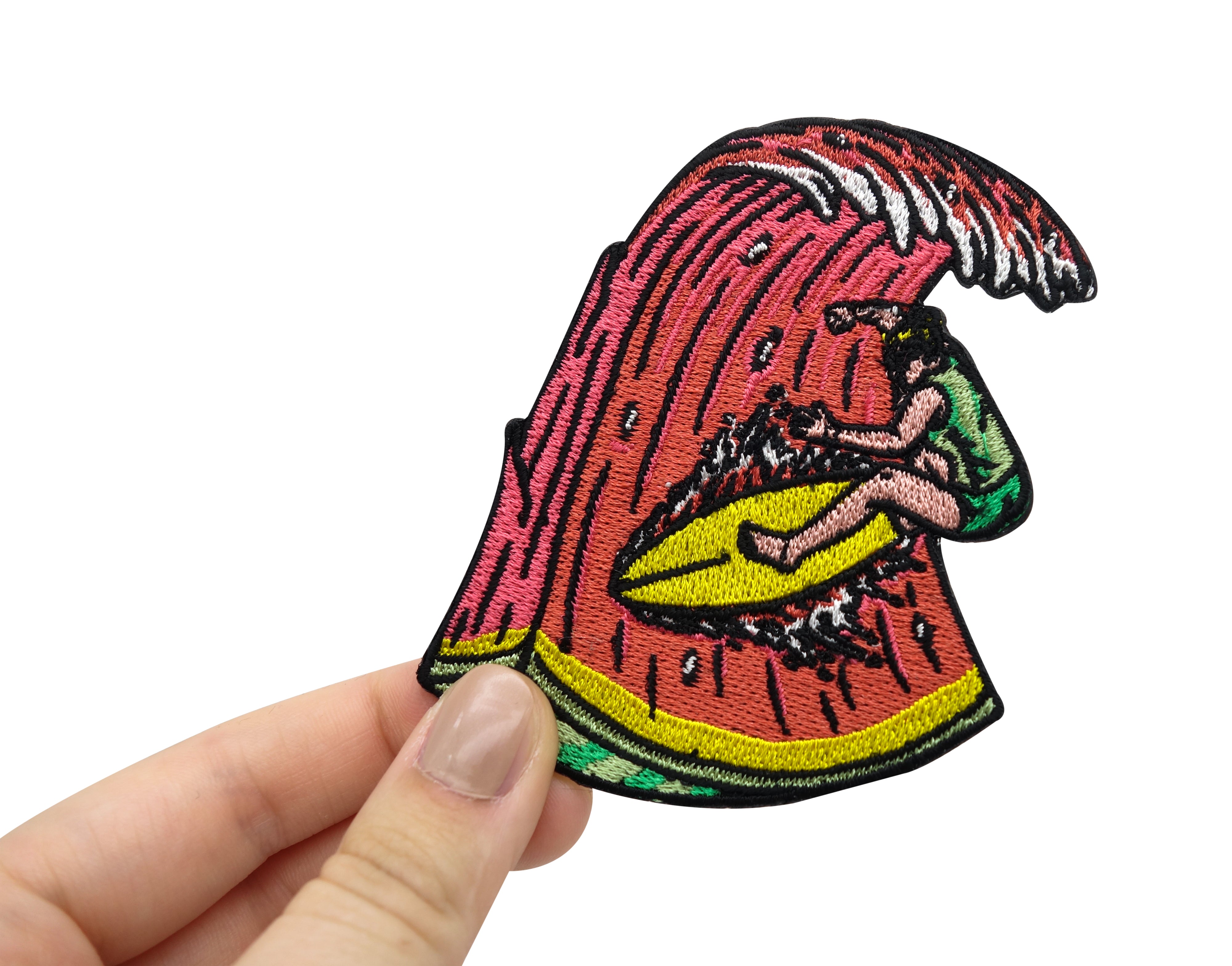 Frauenhand hält den Surf Patch 