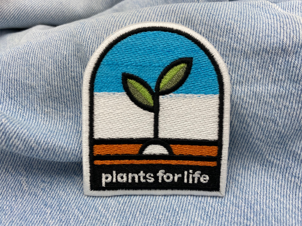 Plants for Life Patch auf hellblauer Jeans