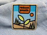 Reduce Plastic Patch auf hellblauer Jeans
