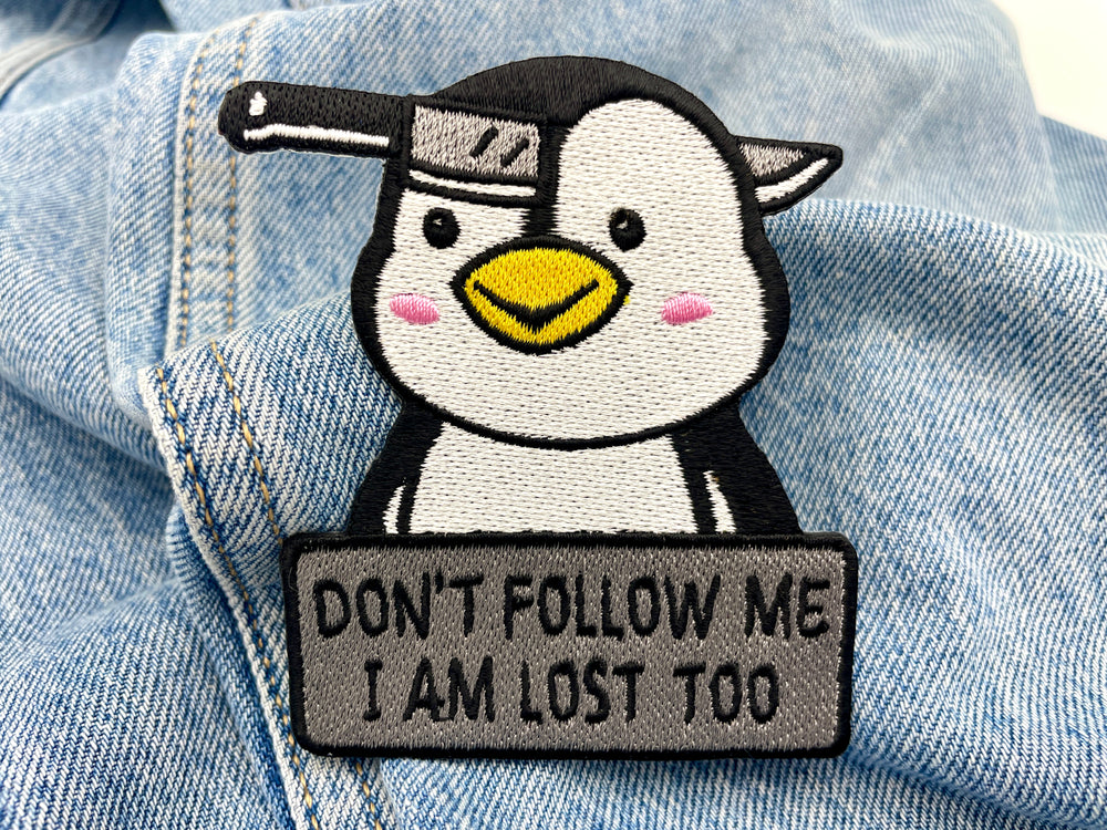 Pinguin Patch auf blauer Jeans