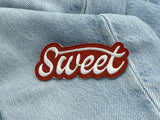 Sweet Patch auf hellblauer Jeans