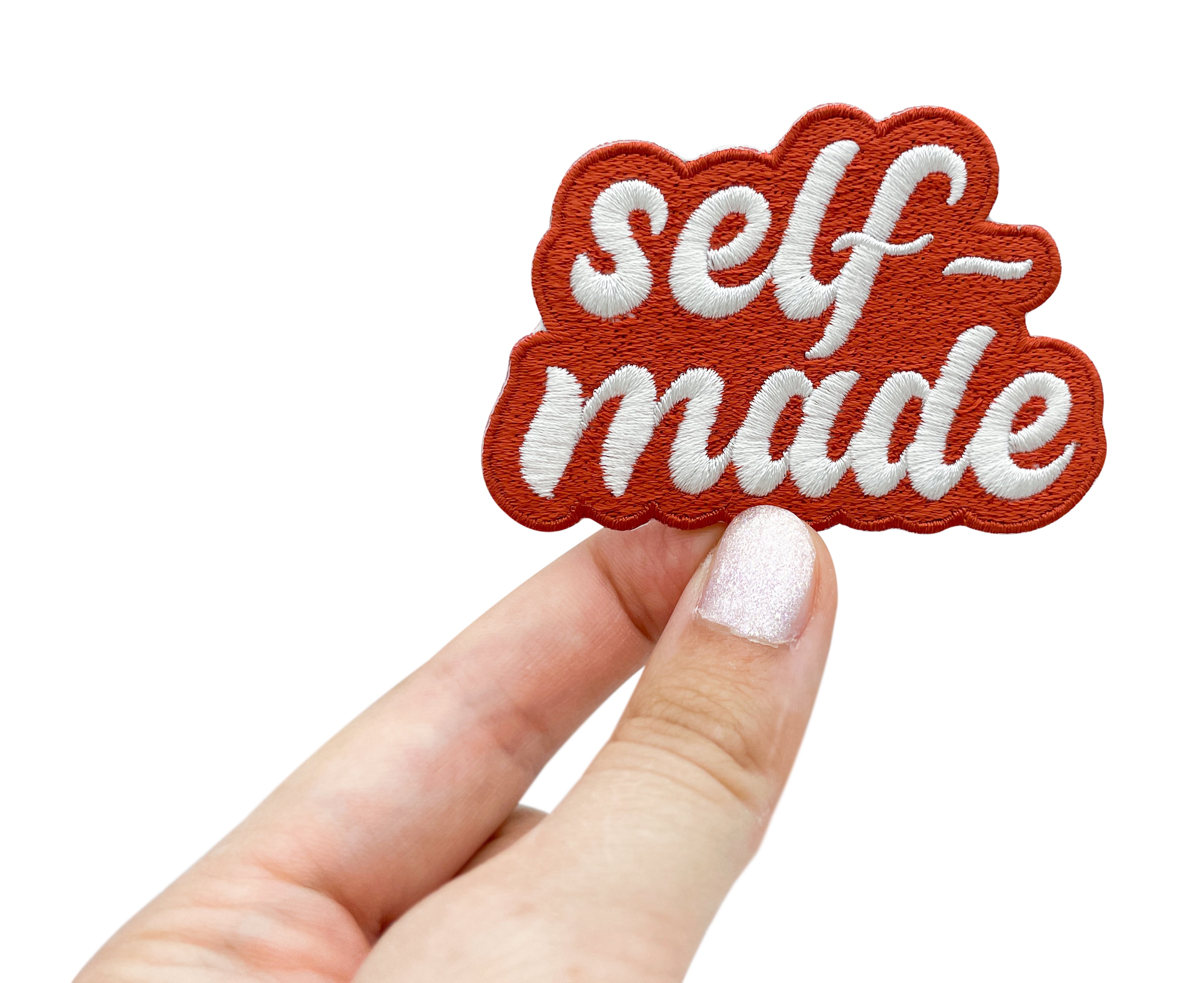 Frauenhand hält den Selfmade Patch