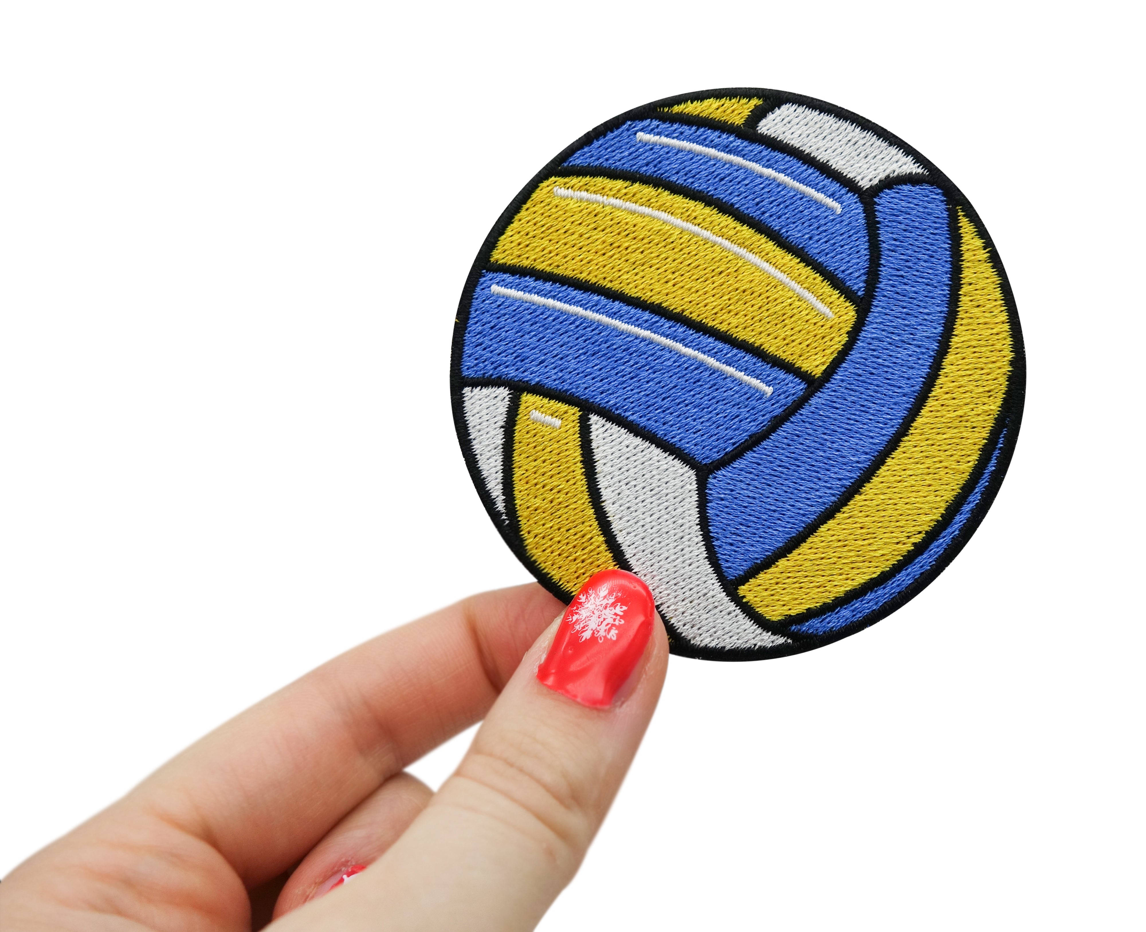 Frauenhand hält den Volleyball Patch