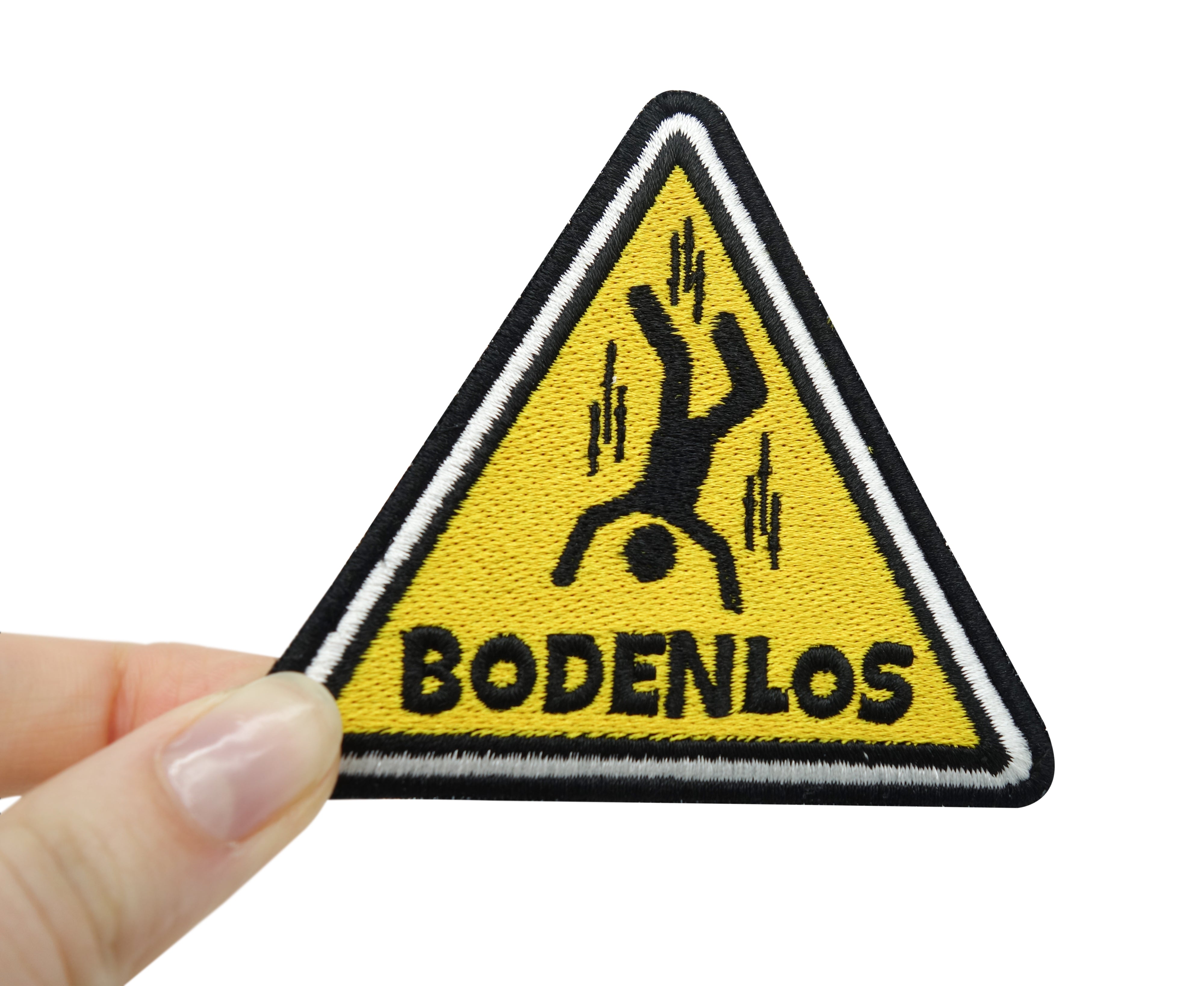 Bodenlos Klettpatch gehalten von einer Frauenhand