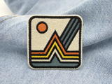 Berg Patch auf hellblauer Jeans