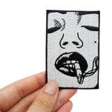 Bad Girl Patch gehalten von einer Frauenhand