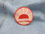 Sonnenuntergang Patch auf hellblauer Jeans