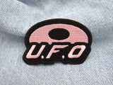 UFO Patch auf hellblauer Jeans