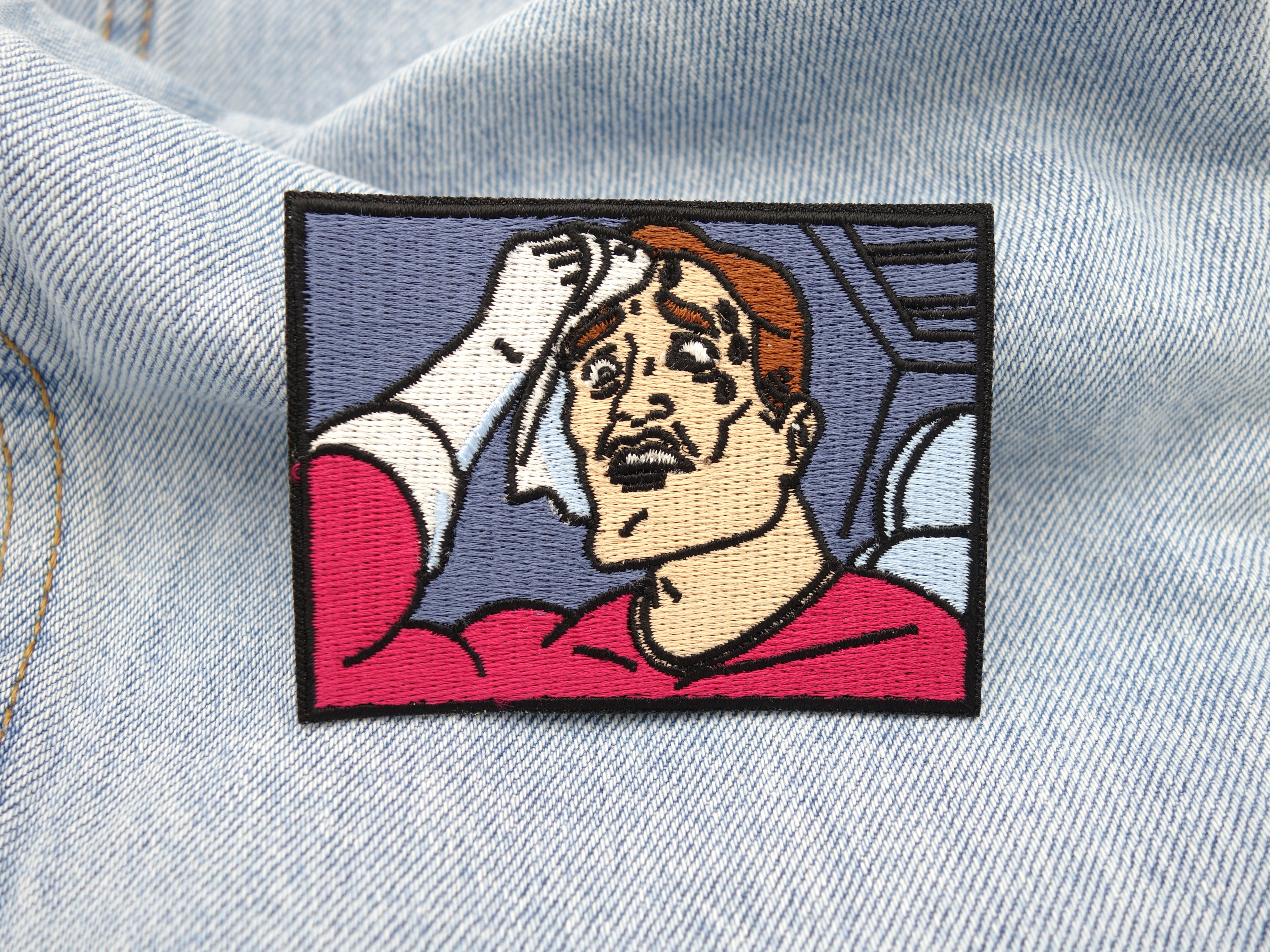 Schwitzender Mann Patch auf hellblauer Jeans