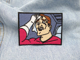 Schwitzender Mann Patch auf hellblauer Jeans