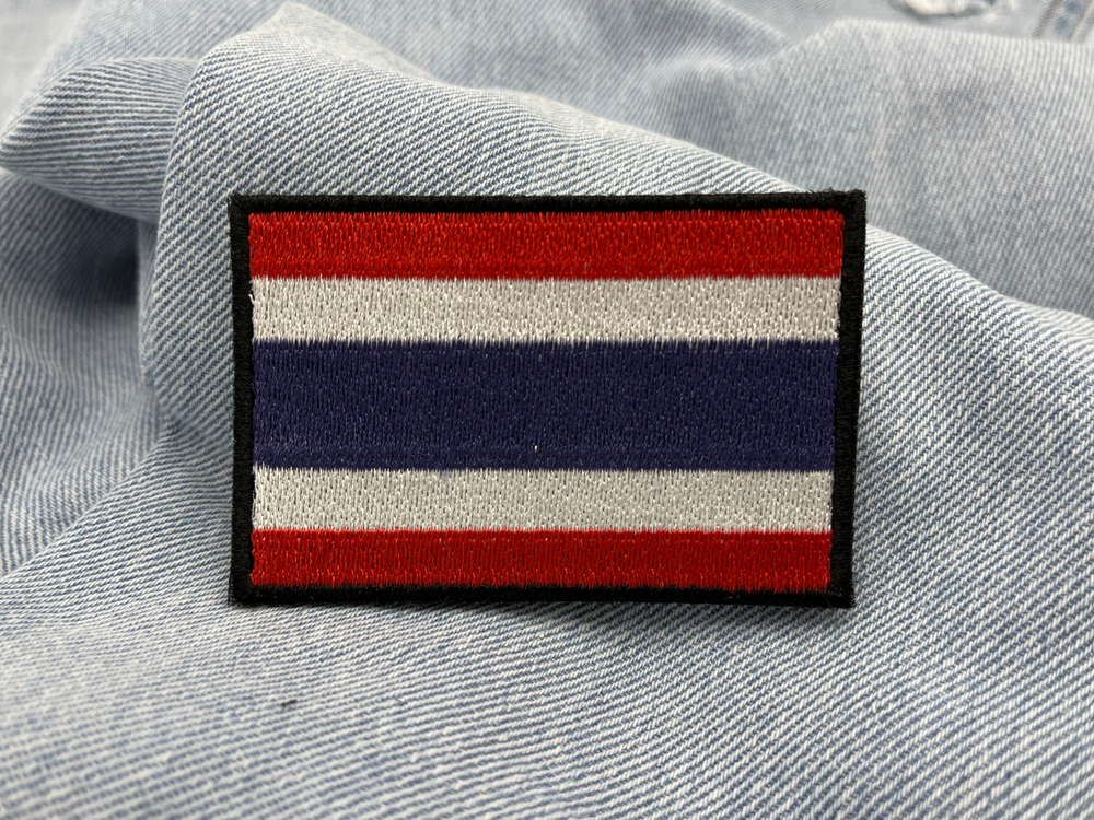 Thailand Klettpatch auf hellblauer Jeans