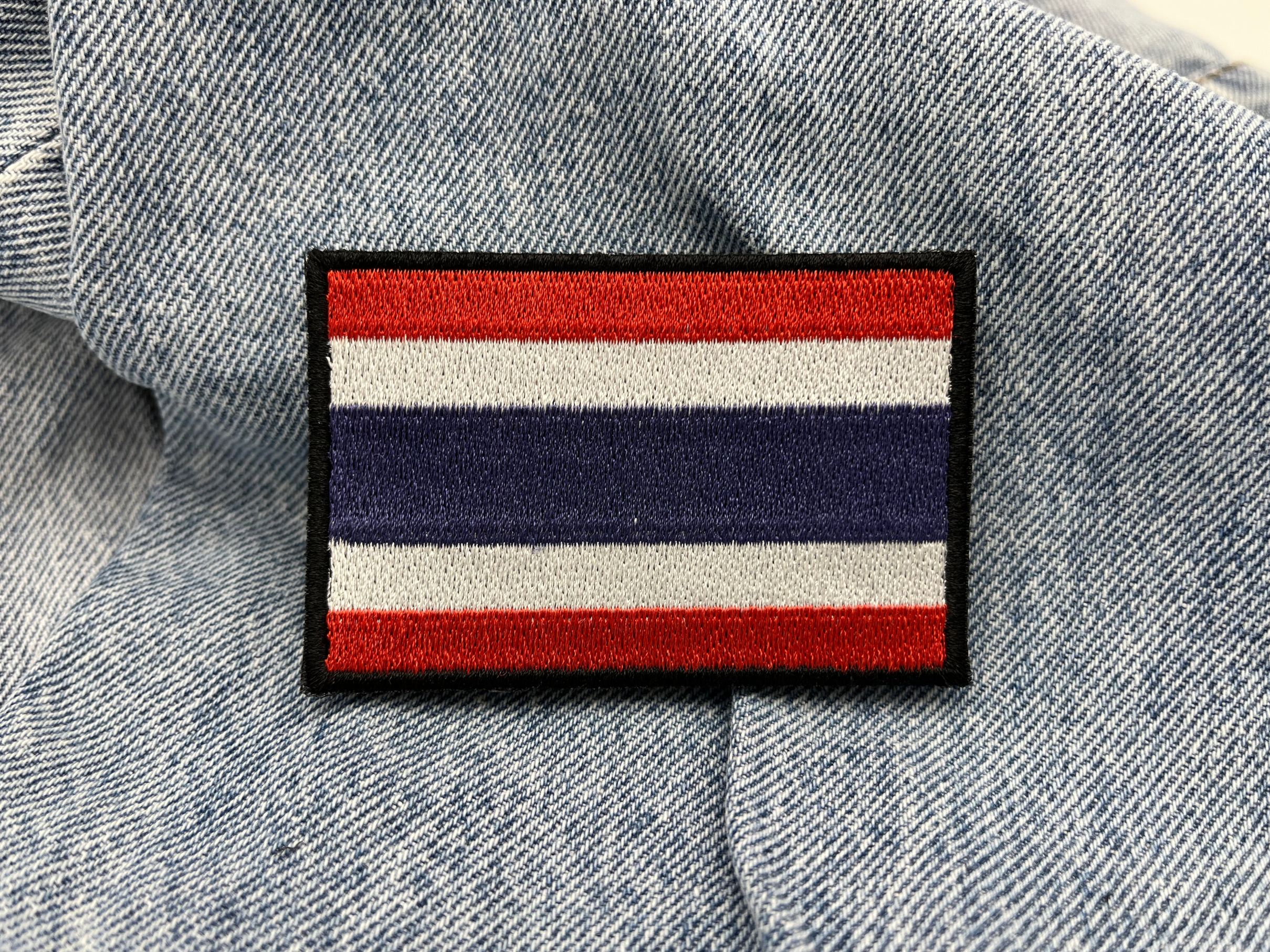 Thailand Klettpatch auf blauer Jeans