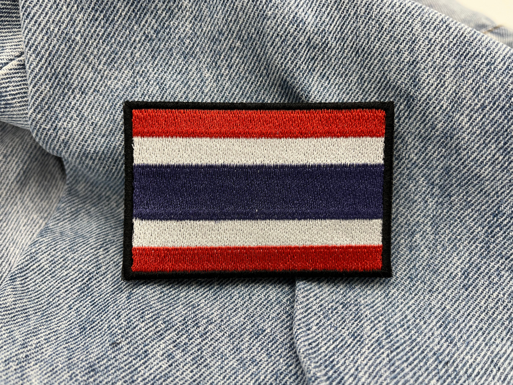 Thailand Klettpatch auf blauer Jeans