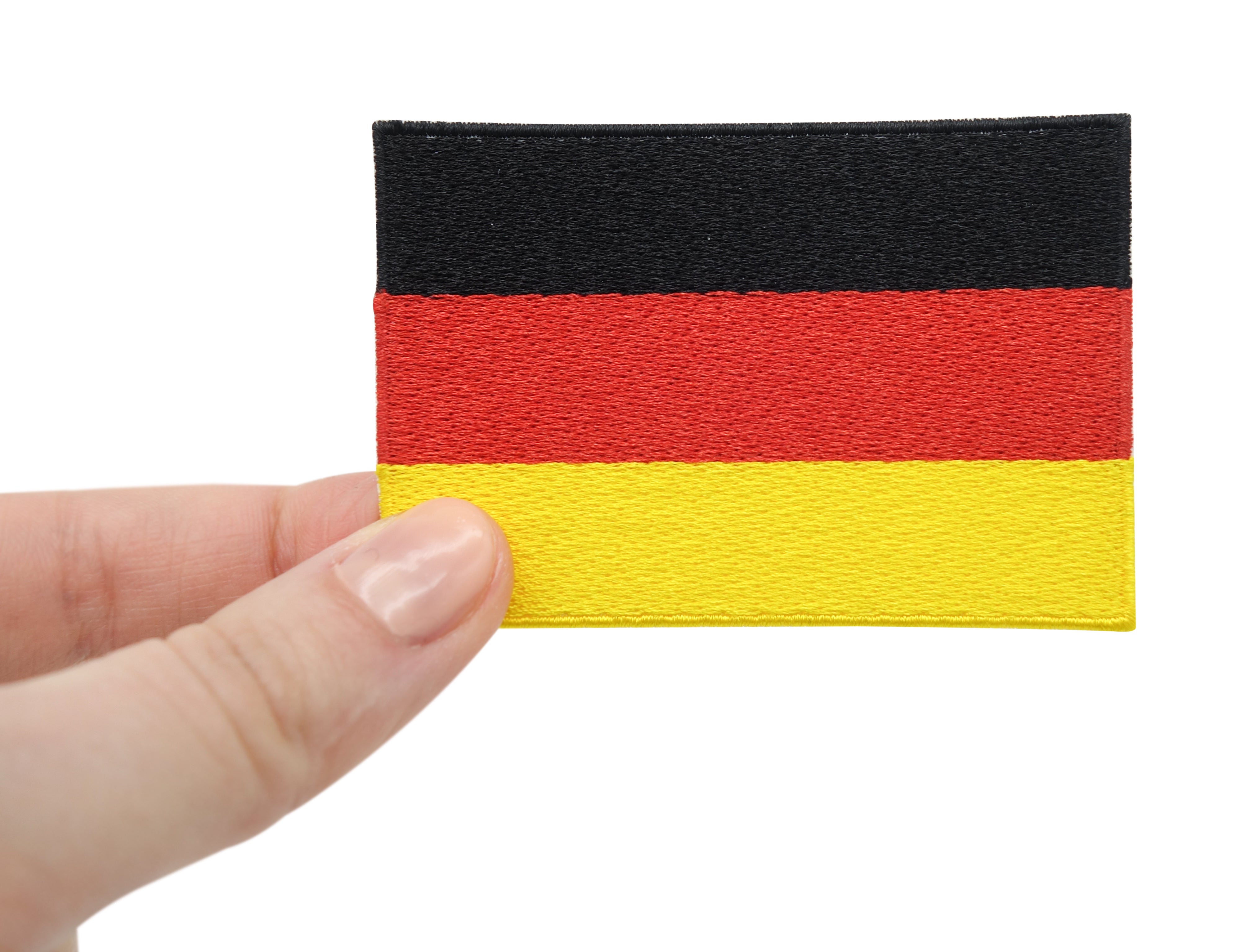 Deutschland Flagge Patch gehalten von einer Frauenhand