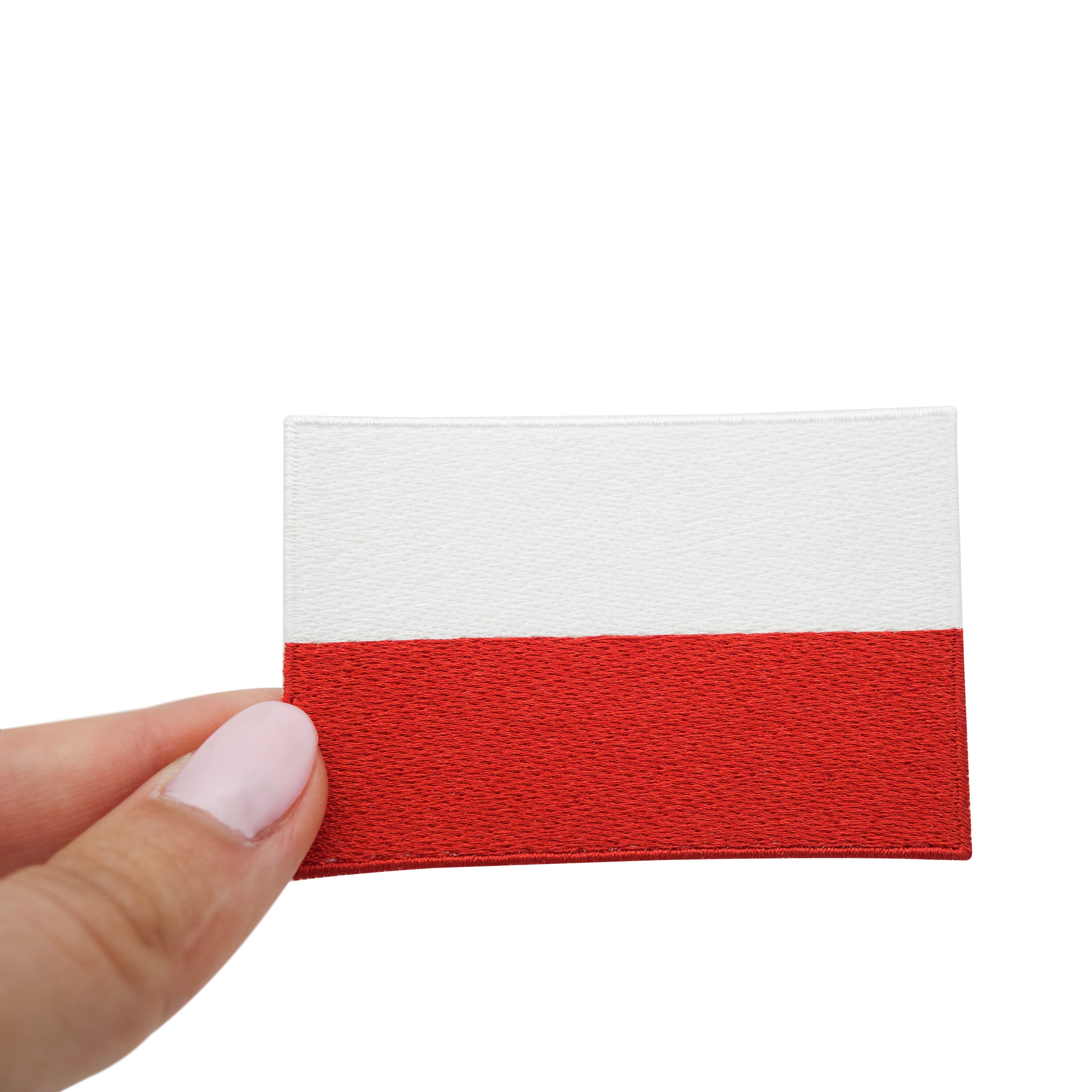 Polen Flagge Patch gehalten von einer Frauenhand 