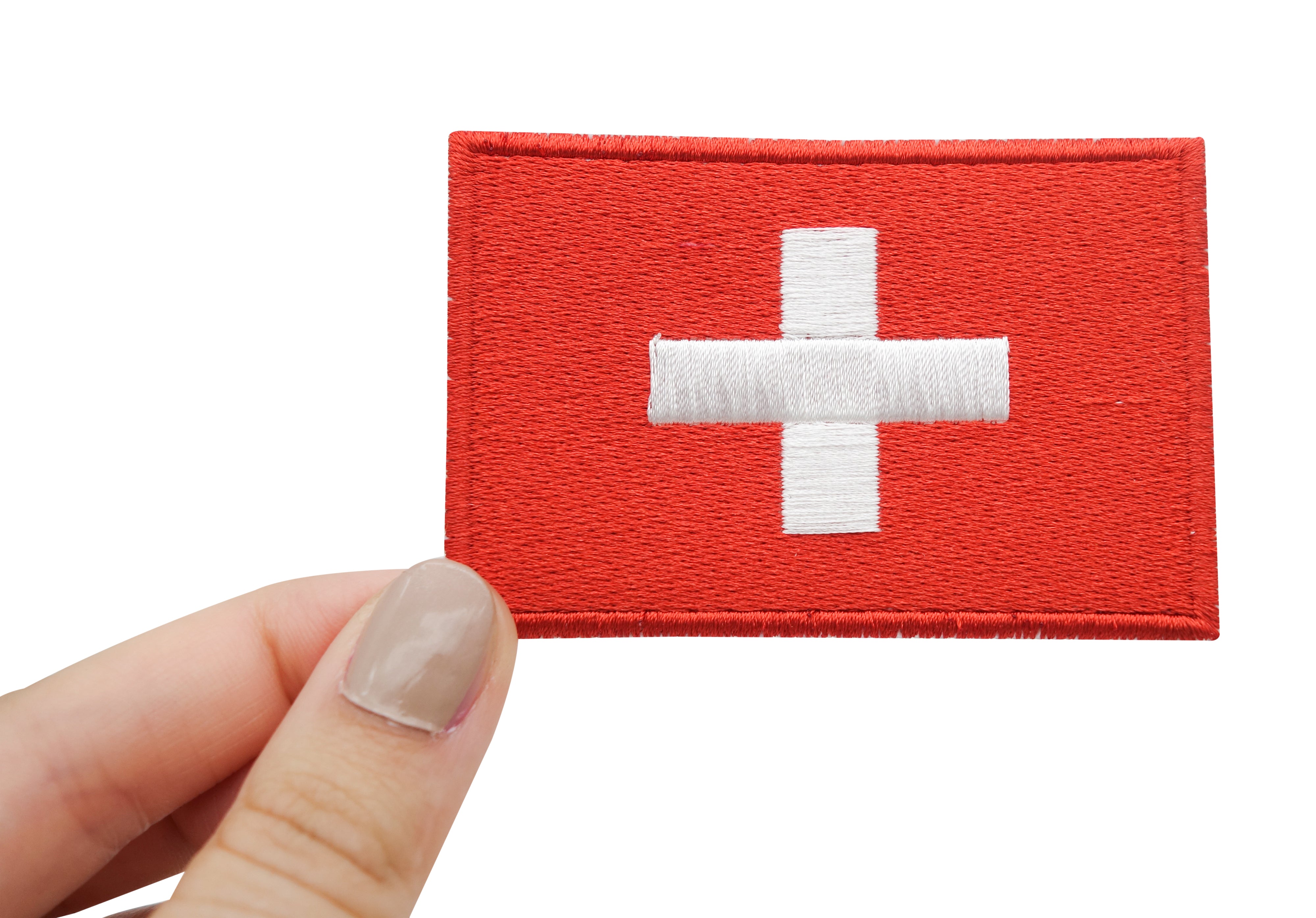Schweiz Flagge Klett Patch gehalten von einer Frauenhand